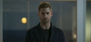 Oliver Jackson-Cohen Cast as Blumhouse’s Invisible Man A man in a black jacket standing in a room.