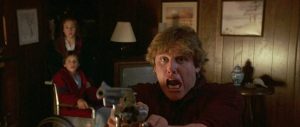 Gary Busey shooting a gun in Silver Bullet from Stephen King