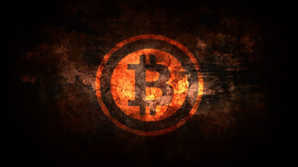 A glowing orange Bitcoin symbol on a dark, textured background.