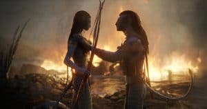 ‘Avatar: The Way Of Water’ Collector’s Edition 4K UHD Blu-Ray Review – A Stunning Return For James Cameron A man and a woman standing in front of a fire.