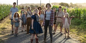 ‘Children Of The Corn’ (2023) 4K UHD Blu-Ray SteelBook Review – The Youth Will Be Our End A group of children with serious expressions standing on a rural road, some holding tools and makeshift weapons.