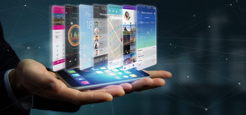 A conceptual image of a person holding a smartphone with futuristic holographic interface applications floating above it.