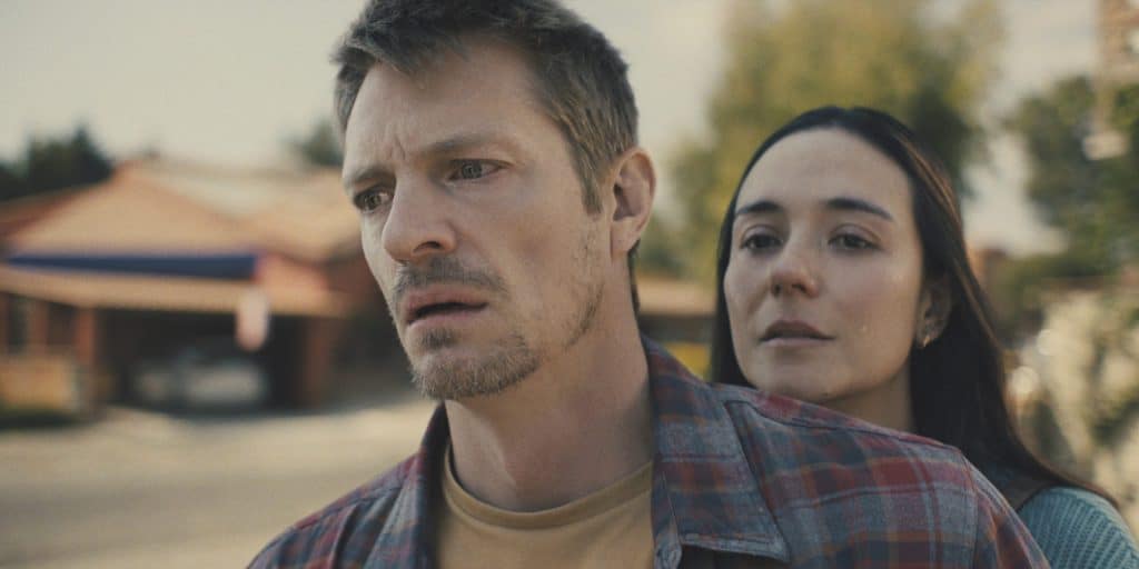A man and woman standing next to each other.