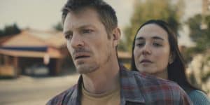 A man and woman standing next to each other.