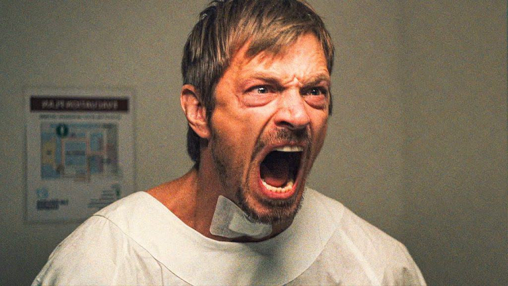 A man yelling in a hospital room.