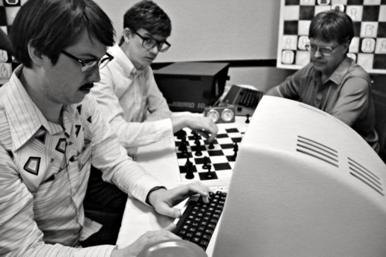 A group of men playing chess.