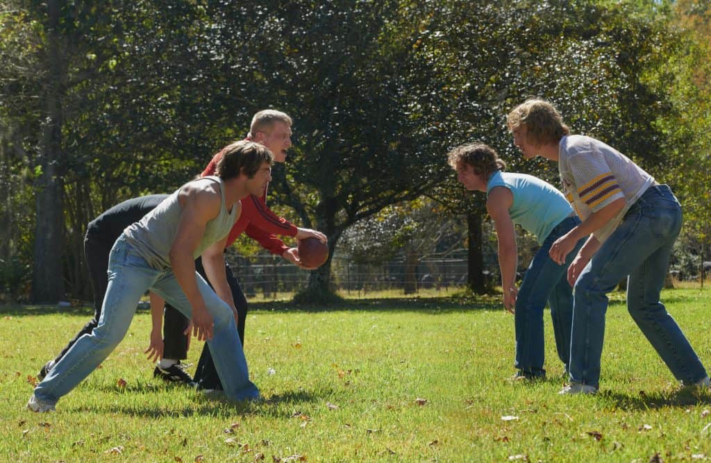A group of people playing a game of frisbee.
