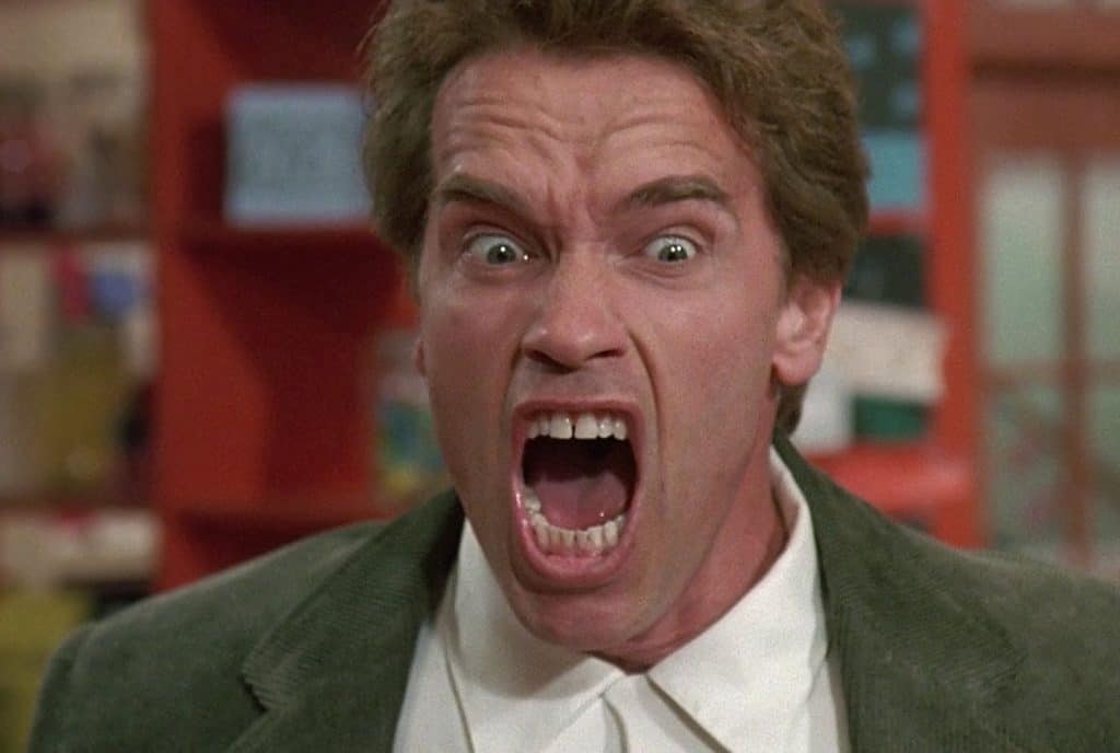 A man in a suit with his mouth open.
