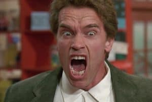 A man in a suit with his mouth open.
