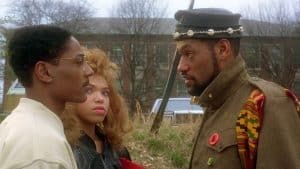 ‘School Daze’ 4K UHD Blu-Ray Review – A Wonderfully Messy & Ambitious Sophomore Joint From Spike Lee A man in a military uniform talking to a woman.
