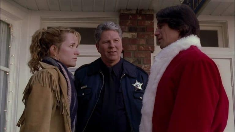 ‘Stealing Christmas’ Blu-Ray Review – Redemptive Holiday Tale Is Surprisingly Effective Three people in santa claus costumes talking to each other.