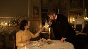 ‘The Taste Of Things’ Blu-Ray Review – A Nourishing Cinematic Dish A man and woman sitting at a table with candles.