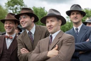 A group of men in suits and hats.