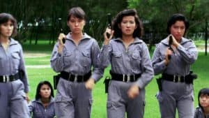 ‘The Inspector Wears Skirts’ Blu-Ray Review – Women Take Center Stage In Martial Arts Action-Comedy A group of women in uniform standing on a grassy field.