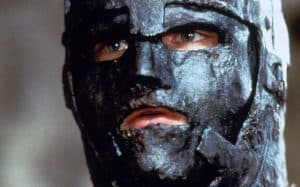 A close up of a man wearing a mask.