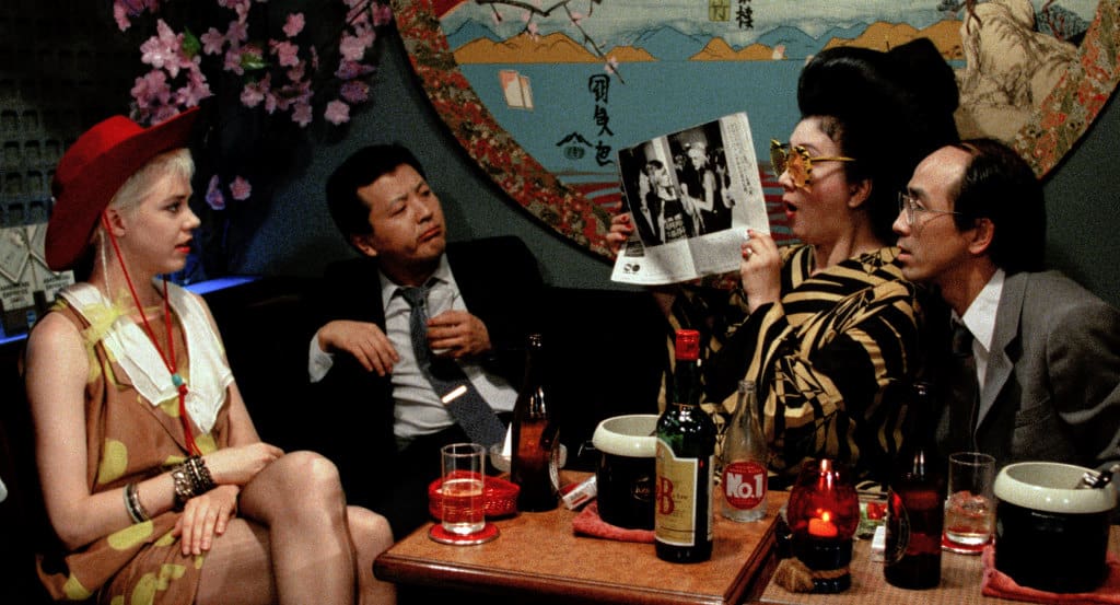A group of people sitting around a table.