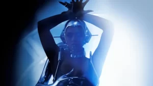 Beyoncé Wakes Up Sleepy Post-Thanksgiving Box Office With ‘Renaissance’ Concert Film A woman in a futuristic outfit is posing in front of a blue light.