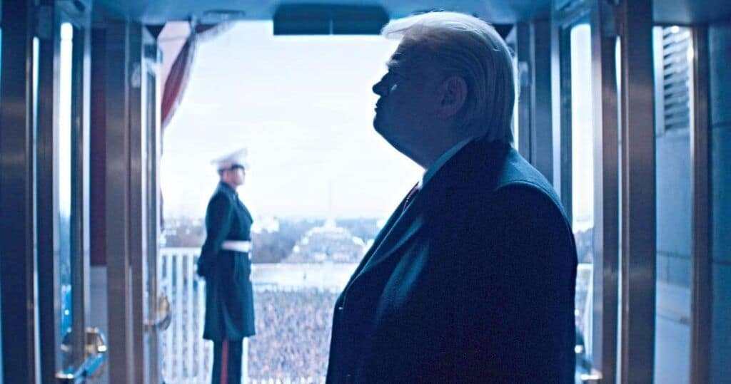 Donald trump looks out of the window of a train.