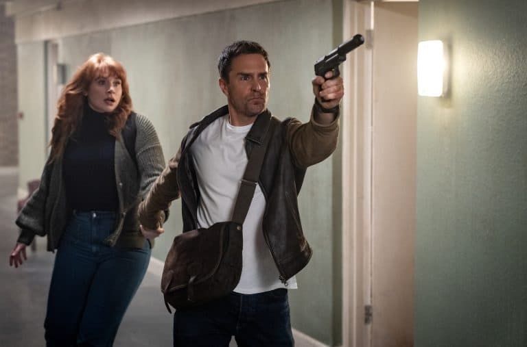 ‘Argylle’ Review – Insanely Absurd From Start To Finish A man and woman holding a gun in a hallway.