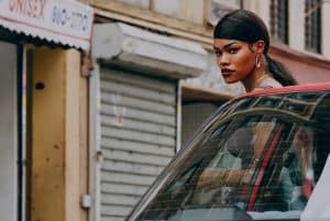 ‘A Thousand And One’ Blu-Ray Review – Teyana Taylor Delivers A Showstopping Performance A woman is leaning out of the window of a car.