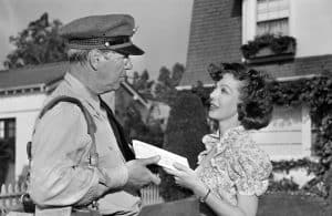 ‘Cause For Alarm!’ Blu-Ray Review – Loretta Young Psychologically Unravels In Terrific Suspense Thriller A man in uniform talking to a woman in front of a house.