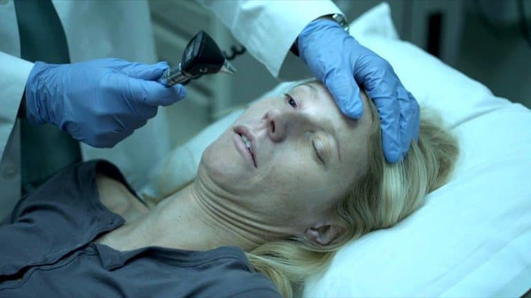 ‘Contagion’ 4K UHD Blu-Ray Review – Steven Soderbergh Thriller Is As Unsettling As Ever A woman is being examined by a doctor in a hospital.