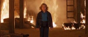 ‘Firestarter’ Collection Limited Edition Blu-Ray Review – New Release Turns Up The Heat On The Franchise A boy standing in front of a fire in a barn.