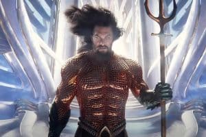 Aquaman is holding a spear in front of a white background.