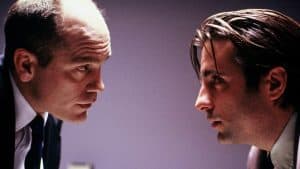 A man looking at another man.