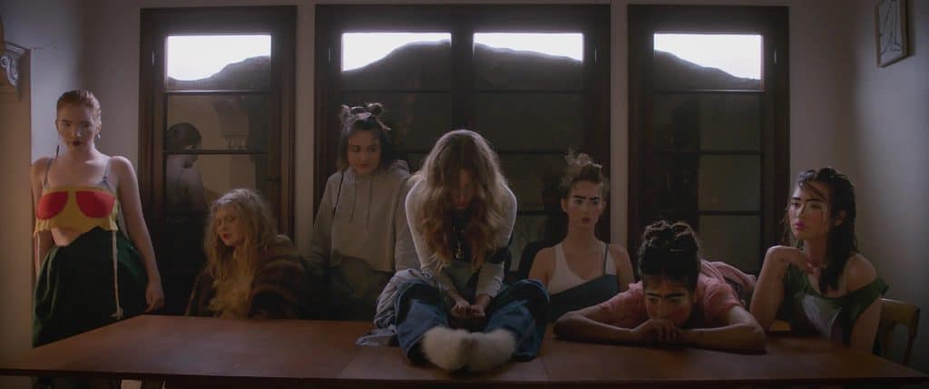 A group of people sitting around a table.