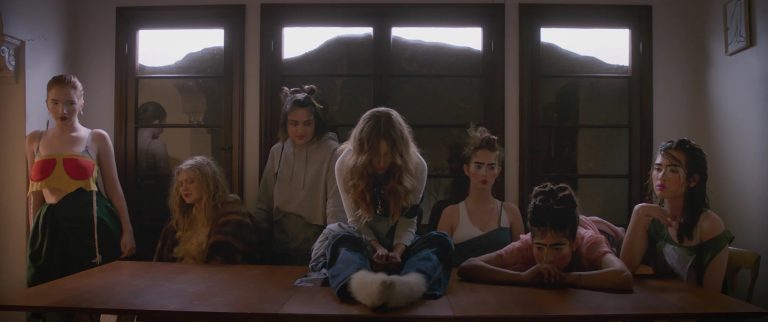 A group of people sitting around a table.