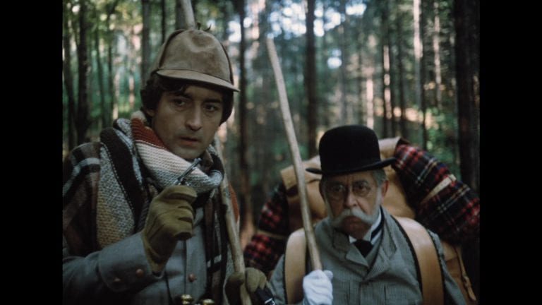 ‘The Mysterious Castle In The Carpathians’ Blu-Ray Review – A Looney Czech Delight Worth Discovering Two men in hats and hats in the woods.