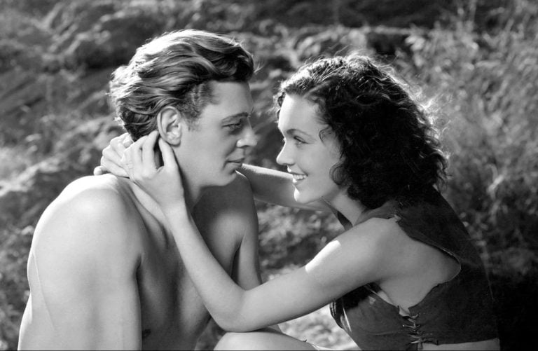 A man and a woman in a black and white photo.