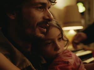 A man holding a little girl.