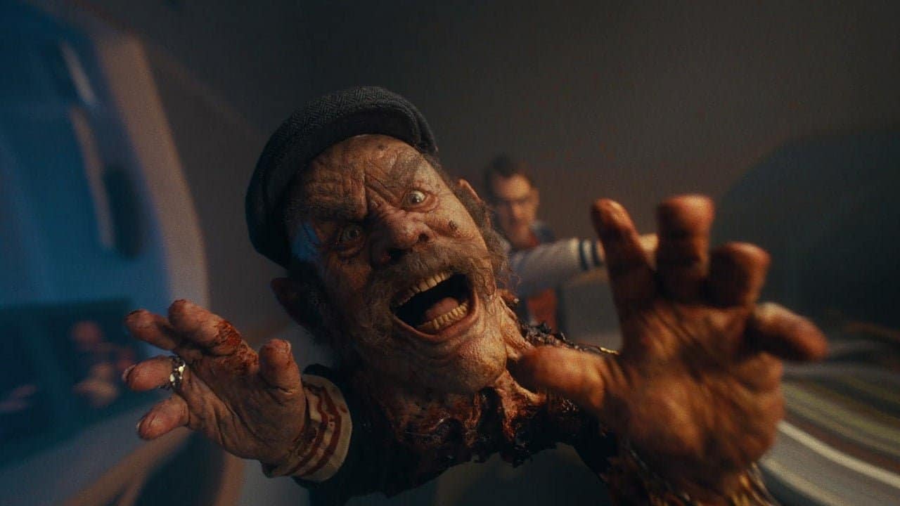 A man with a scary face and hands.