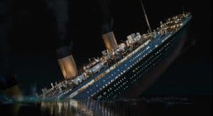 The sinking of the titanic in the ocean.