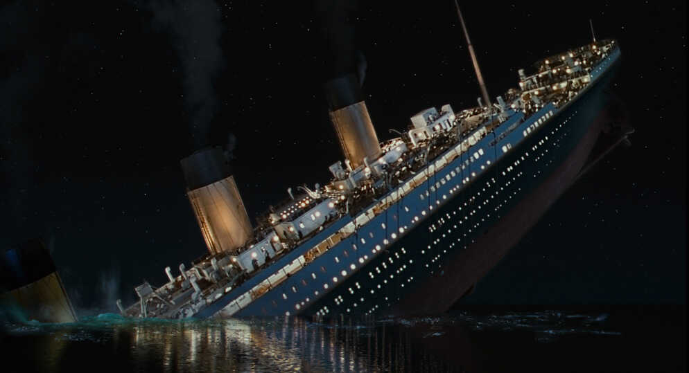 The sinking of the titanic in the ocean.