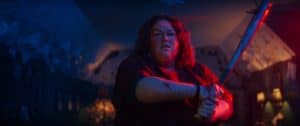 A woman holding a bat.