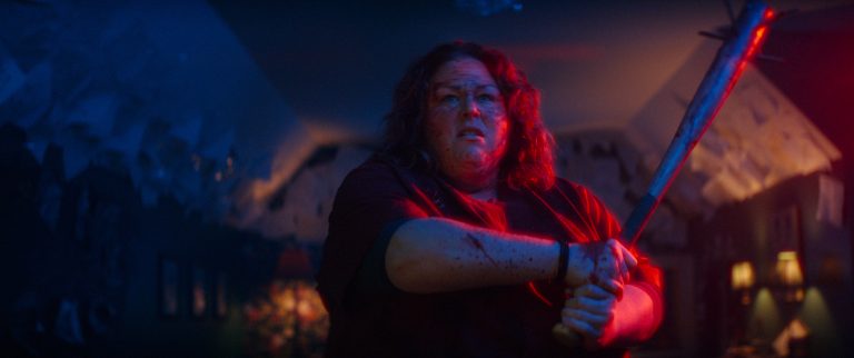 A woman holding a bat.