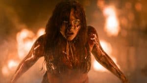 A woman with blood on her face.