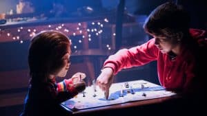 A boy and a girl playing a game of chess.