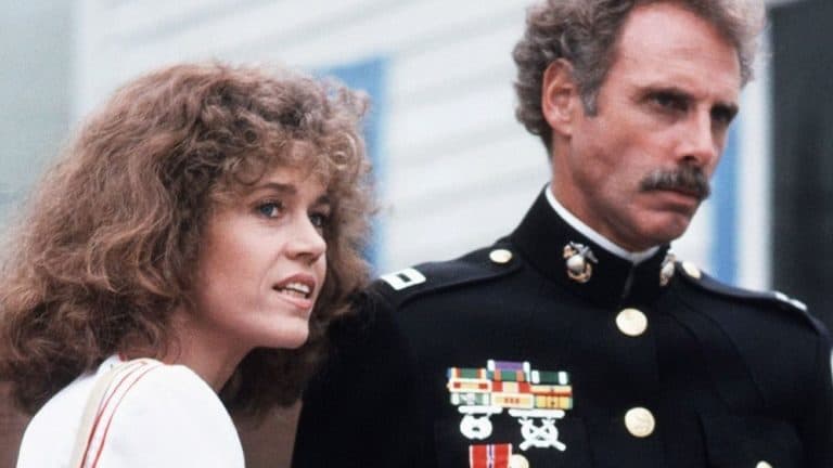 A man and woman in uniform standing next to each other.