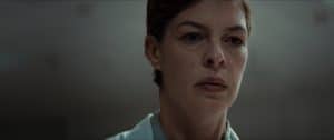Epic Pictures ‘DOUBLE BLIND’ To Hit Theaters February 9 (EXCLUSIVE CLIP) A woman in a white shirt is staring at the camera.