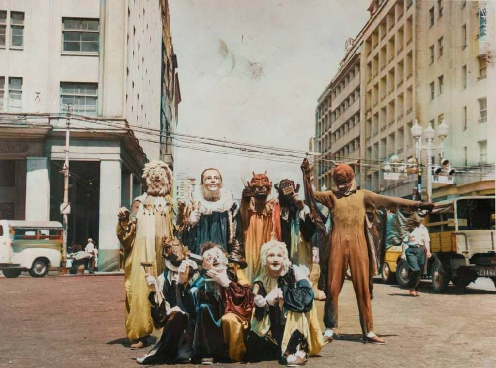 A group of people in clothing posing for a photo.