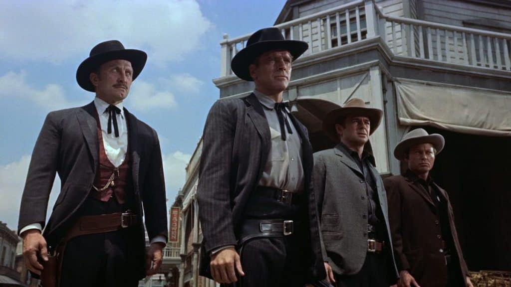 Three men in cowboy hats standing next to each other.