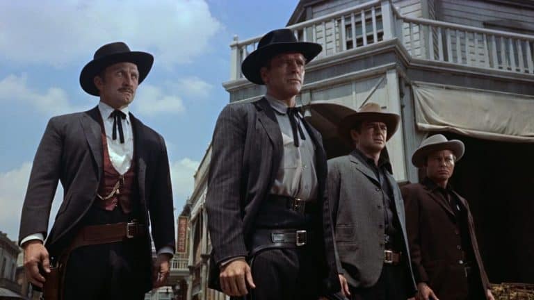 Three men in cowboy hats standing next to each other.