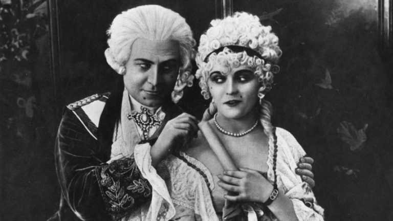 An old black and white photo of a man and woman.