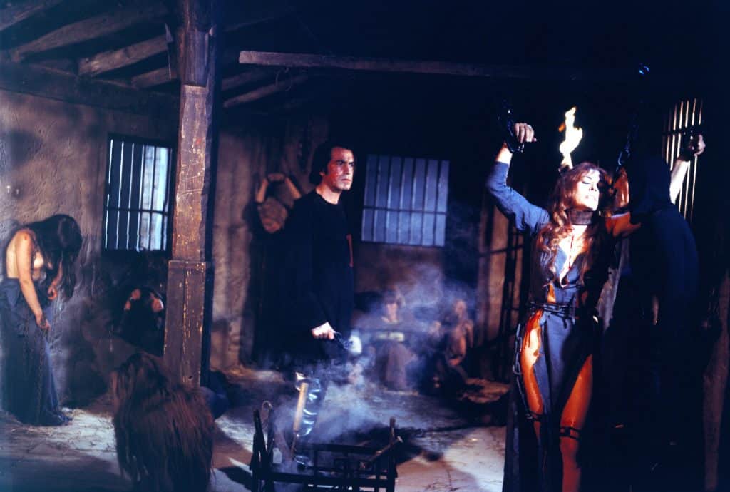 A woman holding a gun and a man holding a gun.