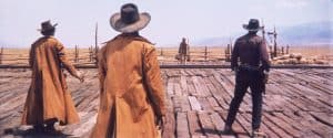 Paramount Presents ‘Once Upon A Time In The West’ 4K UHD Blu-Ray Review – Iconic Cinema From Sergio Leone Three men in cowboy hats standing on a wooden platform.