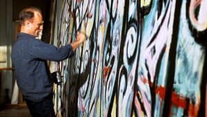 ‘Pollock’ Blu-Ray Review – Ed Harris Puts His Soul Into The Life Of The Famous Painter A man painting a wall.